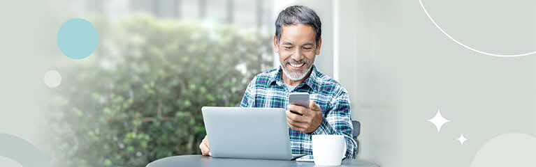 Senior at cafe with laptop and coffee