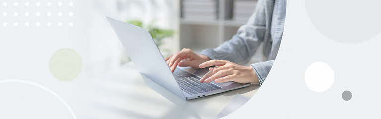 Man in office,  typing on laptop