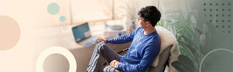 Young man looking at laptop