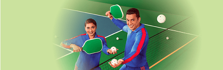 Couple playing pickleball