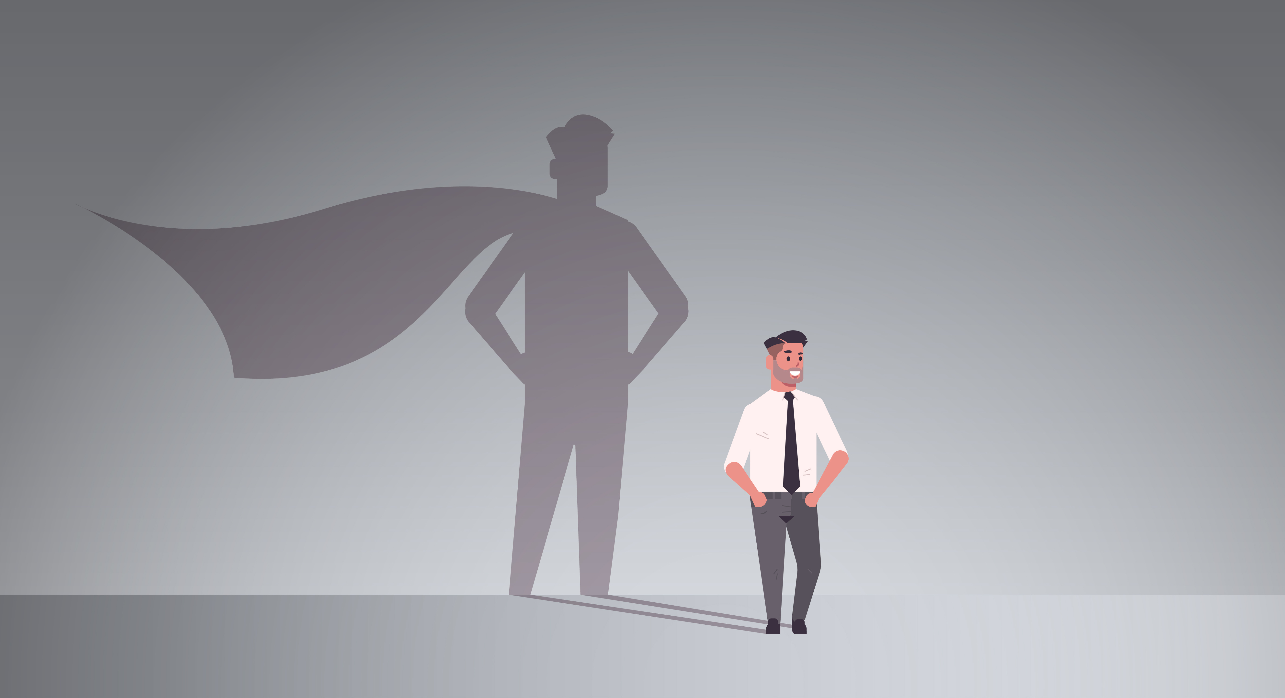 Businessman with a shadow of himself as a superhero with cape
