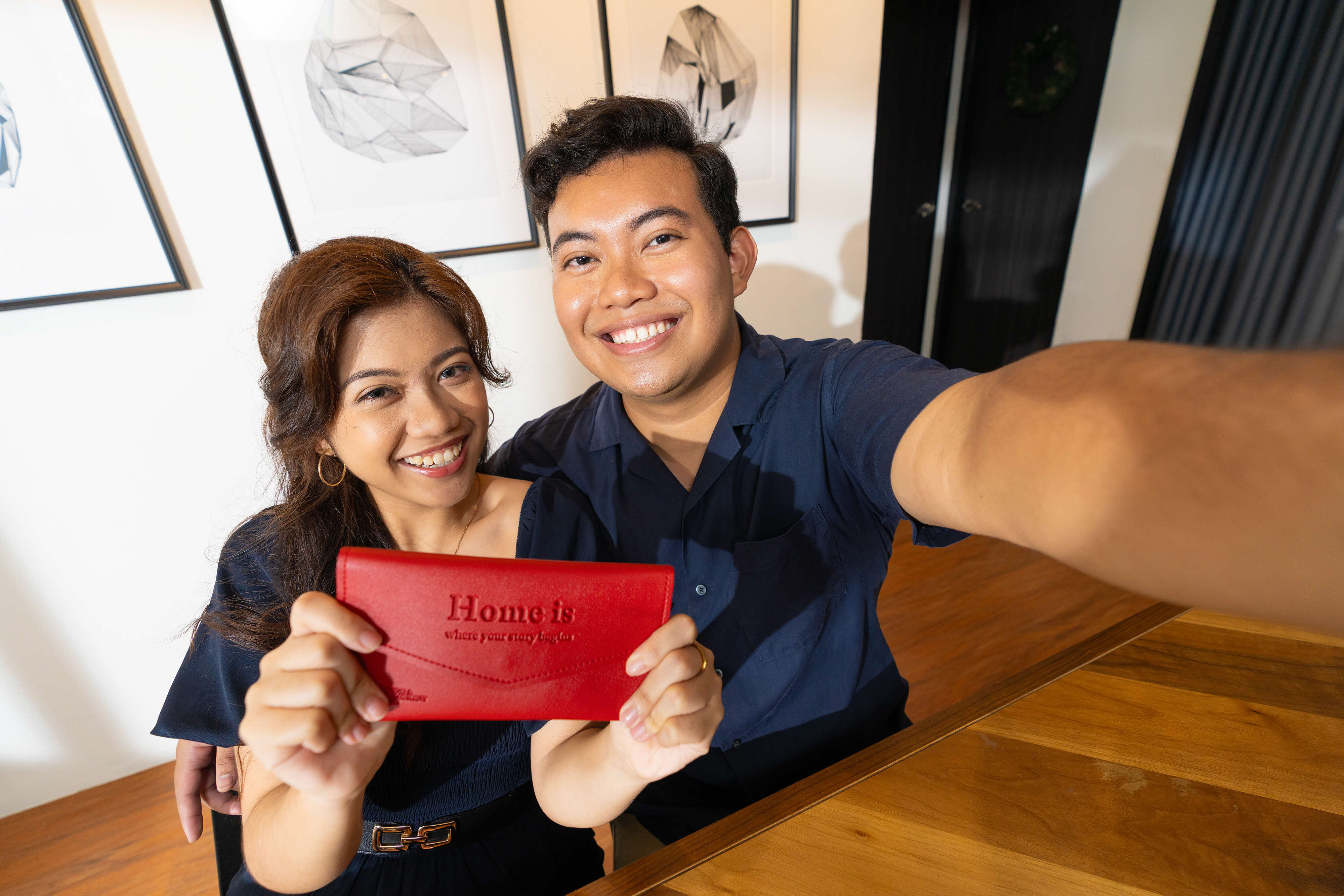 Young couple with their new HDB keys