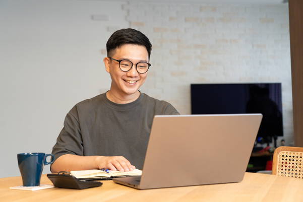 Man looking at his laptop