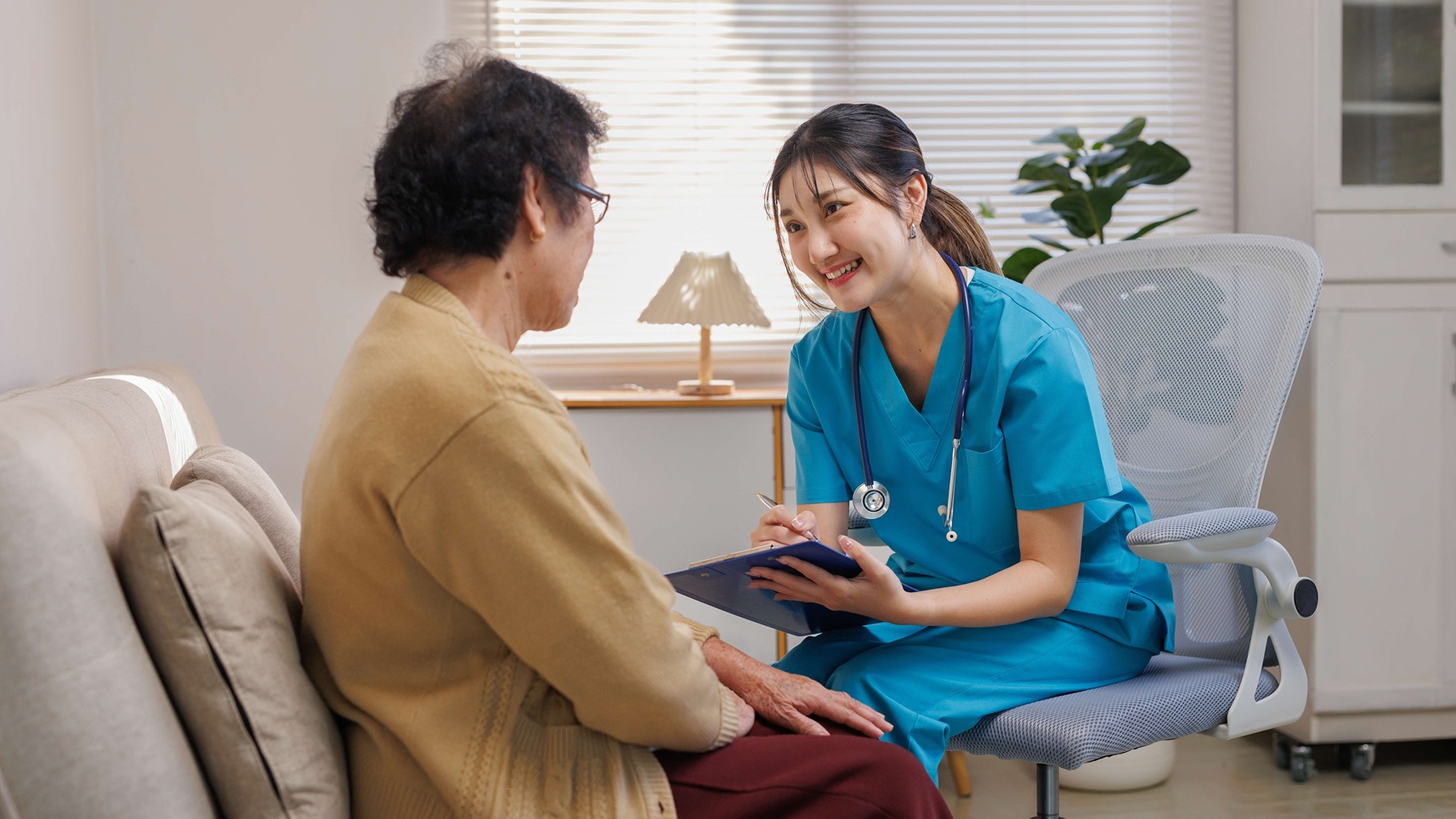 Nurse asking her patient questions