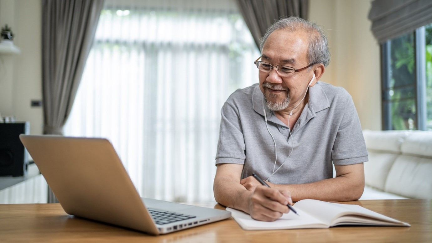 Elderly man using a laptop 