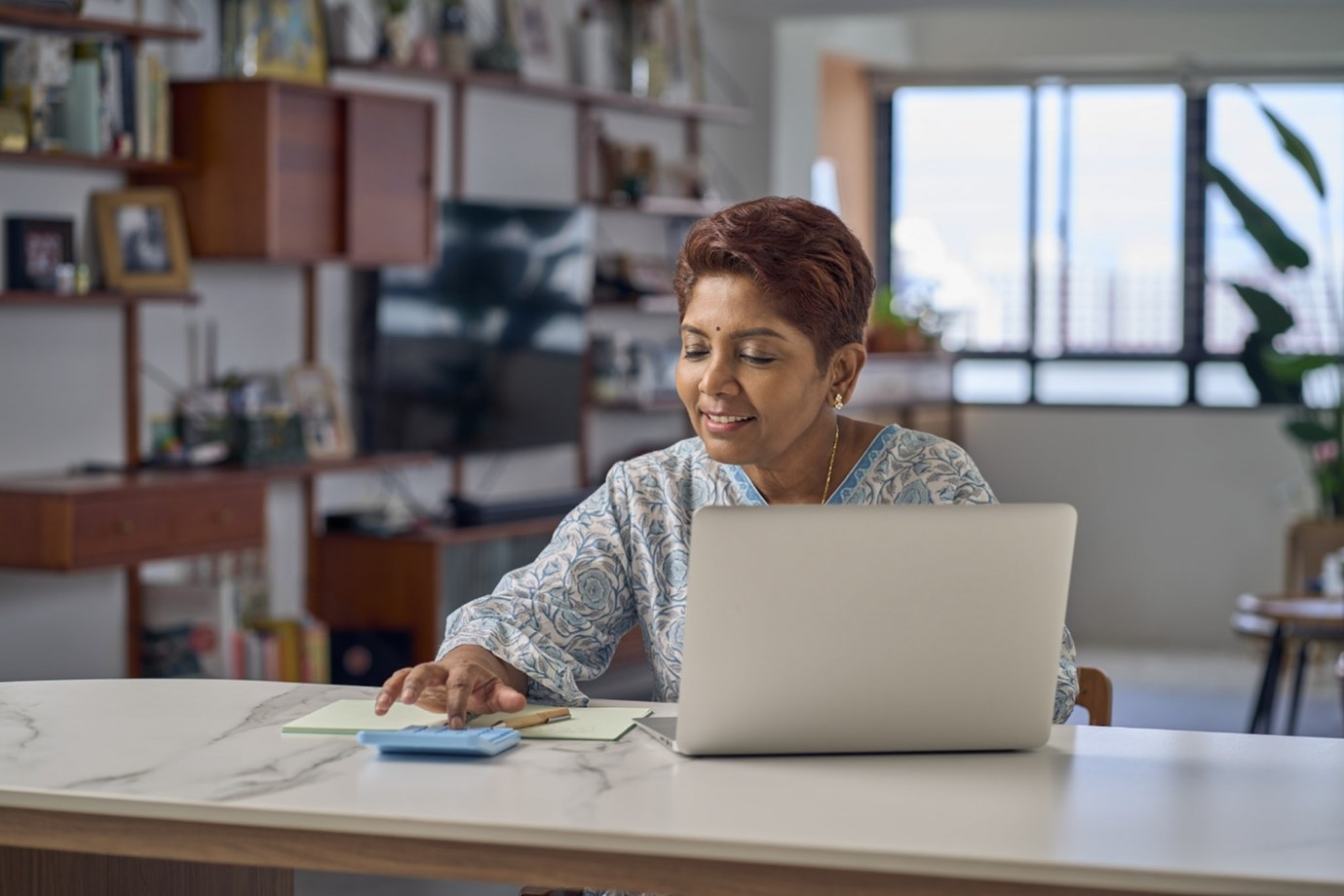 Middle aged lady working on her computer