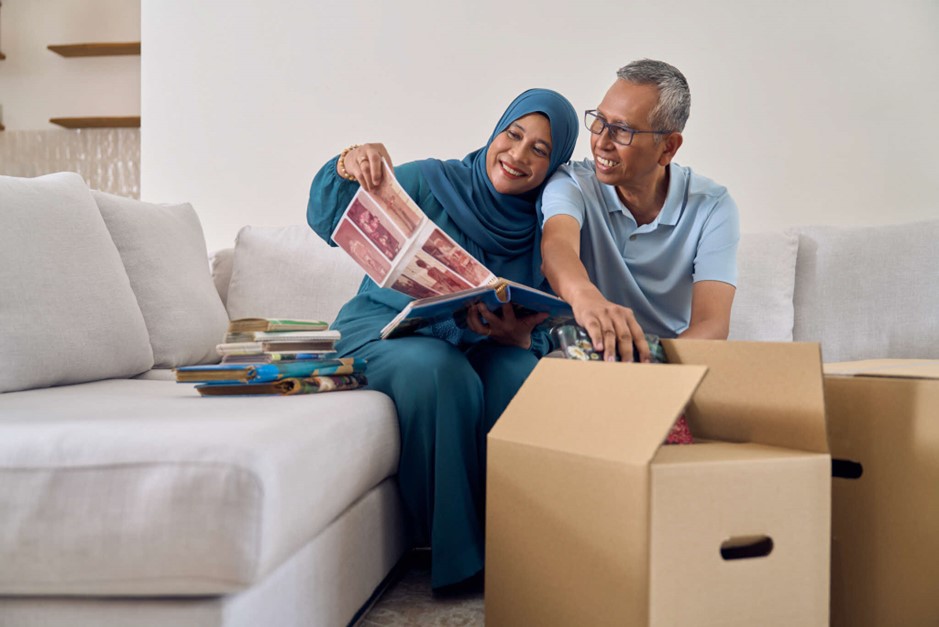 Elderly couple looking at photos