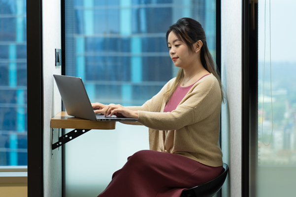Lady looking at her laptop