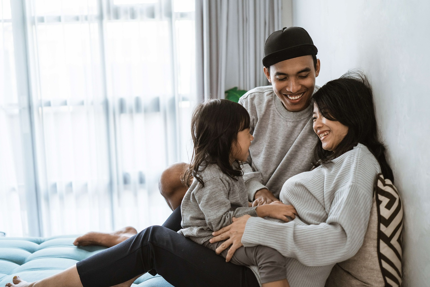 Young Malay family relaxing together