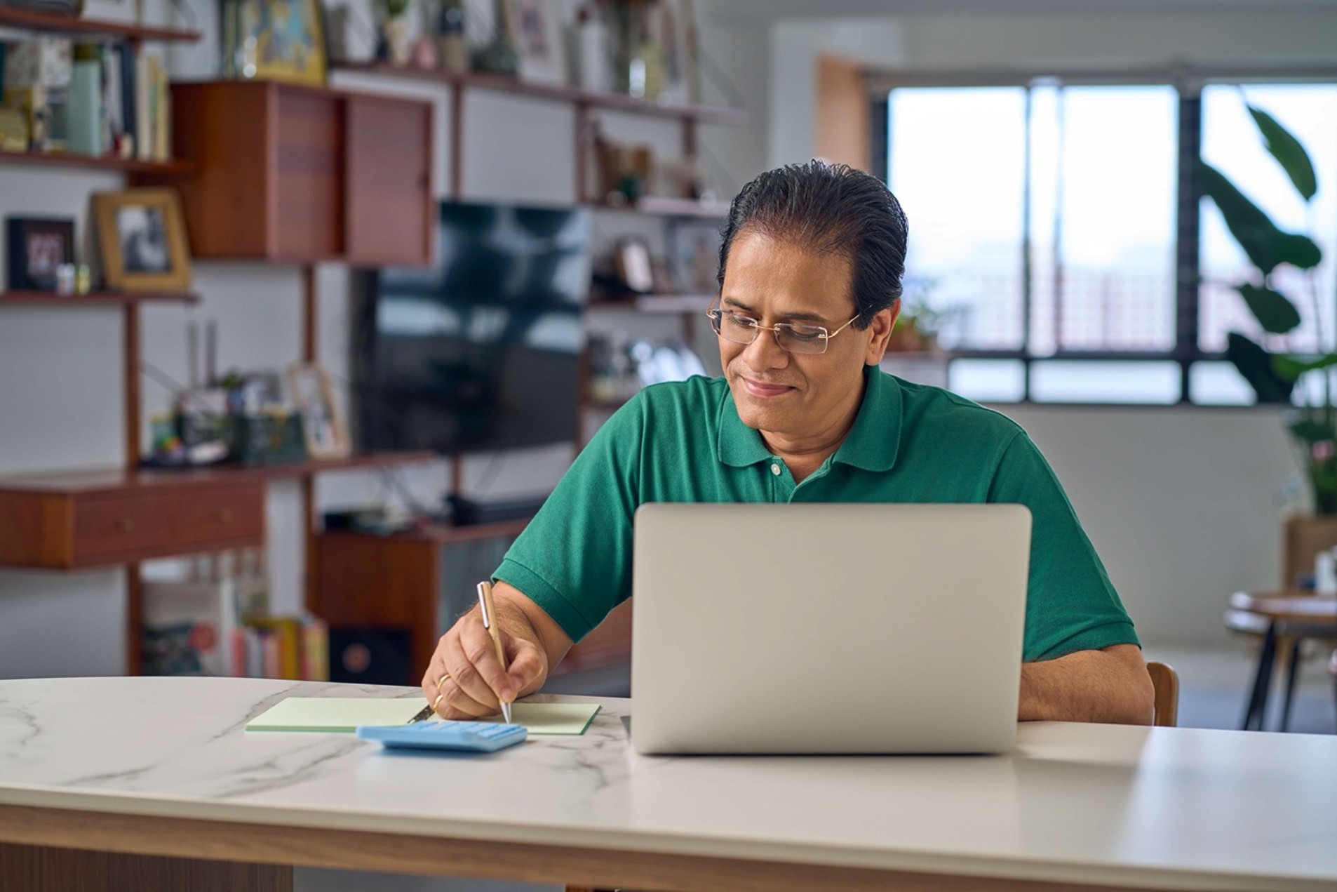 Man looking at his laptop