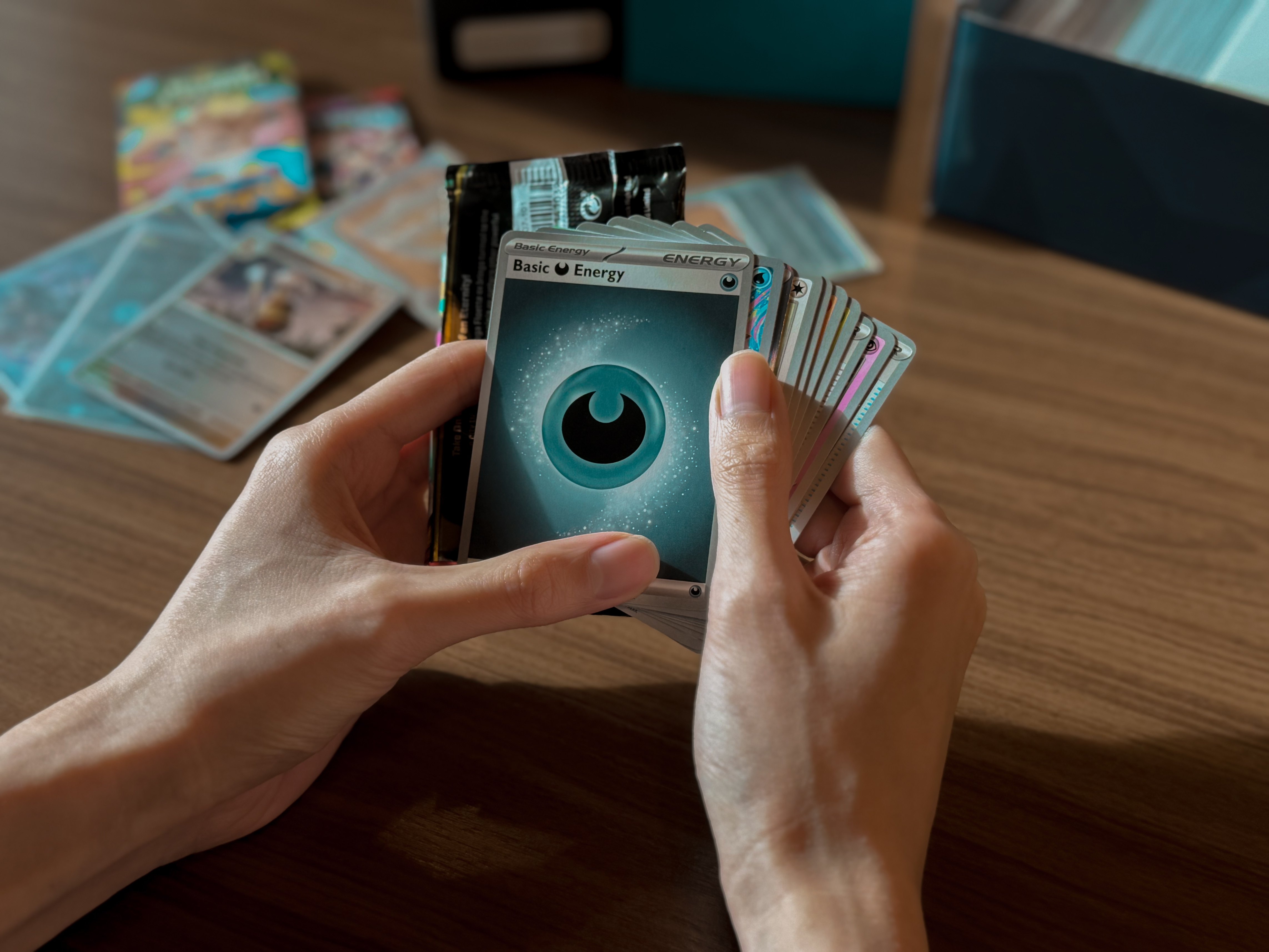 Hand fanning out pokemon cards