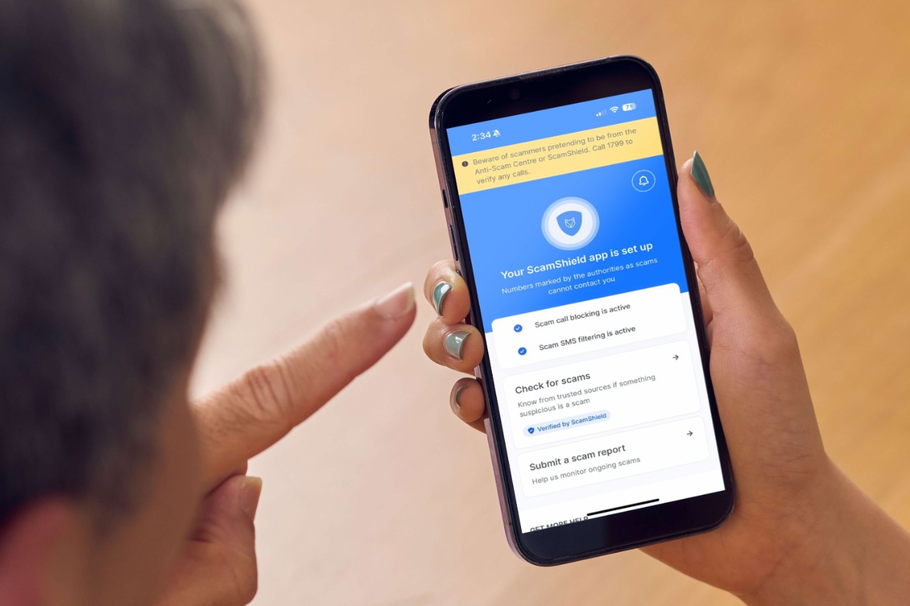 Using ScamShield app on mobile phone