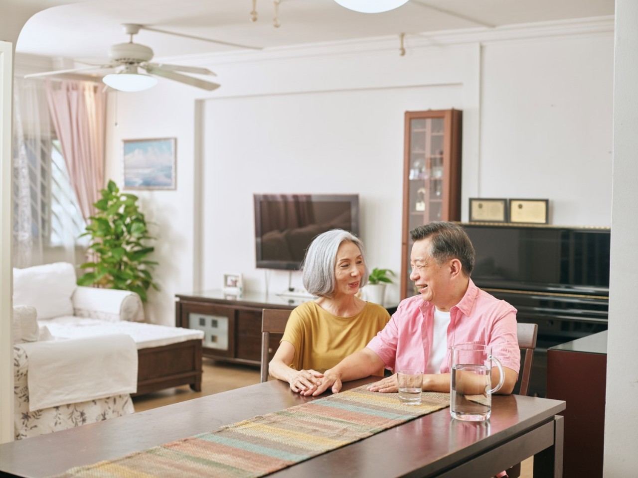 MRSSchineseseniorcouple flat and condo along a street