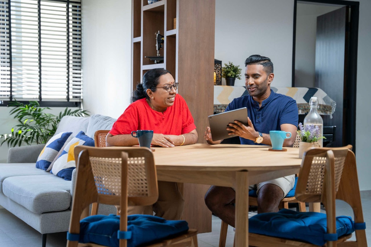 Indian mother and son with a tablet 