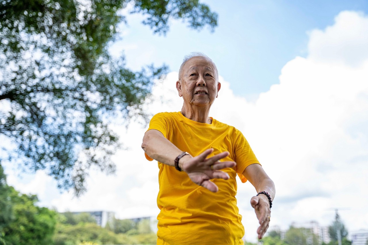 Elderly man exercising in the park 