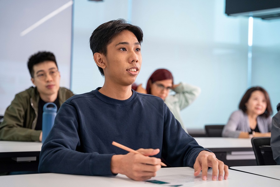 Man listening attentively in class