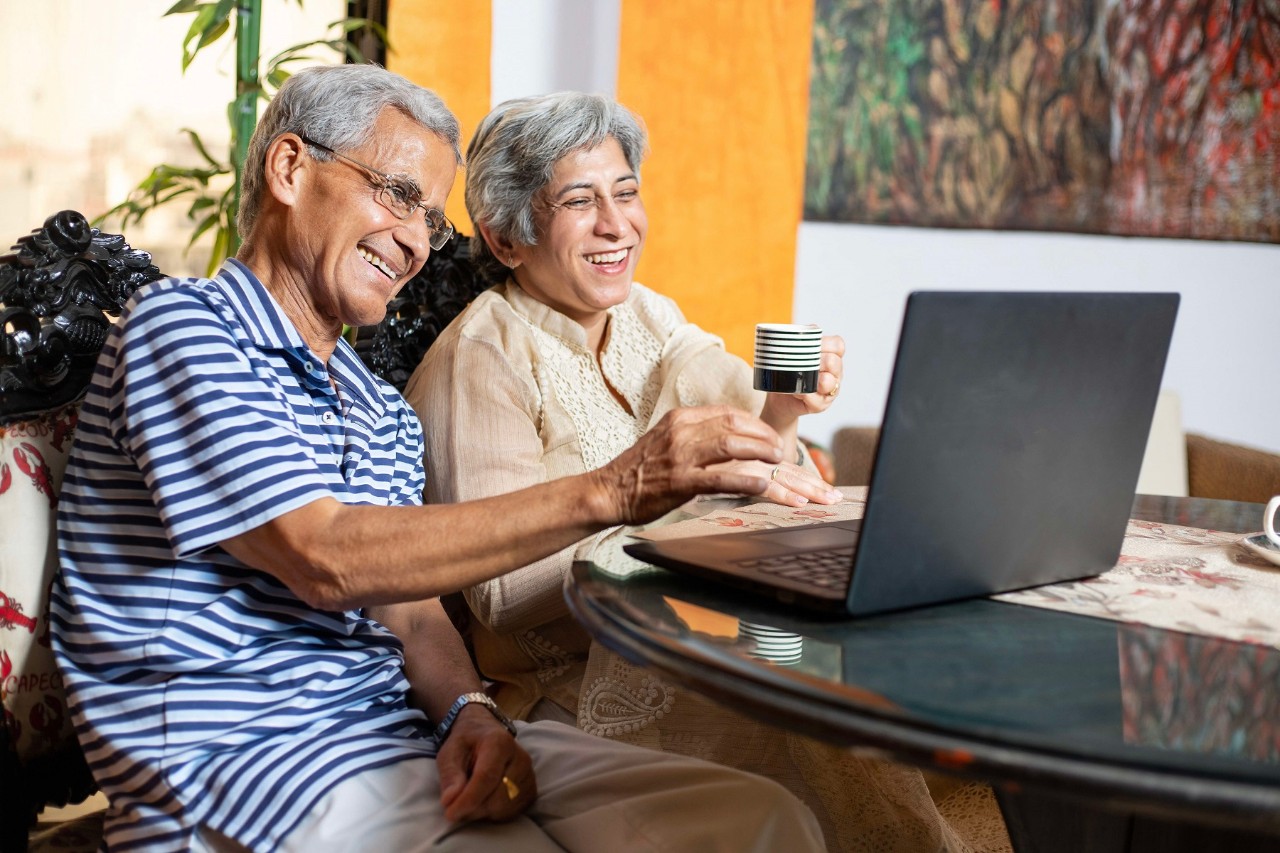 elderly couple enjoying a video