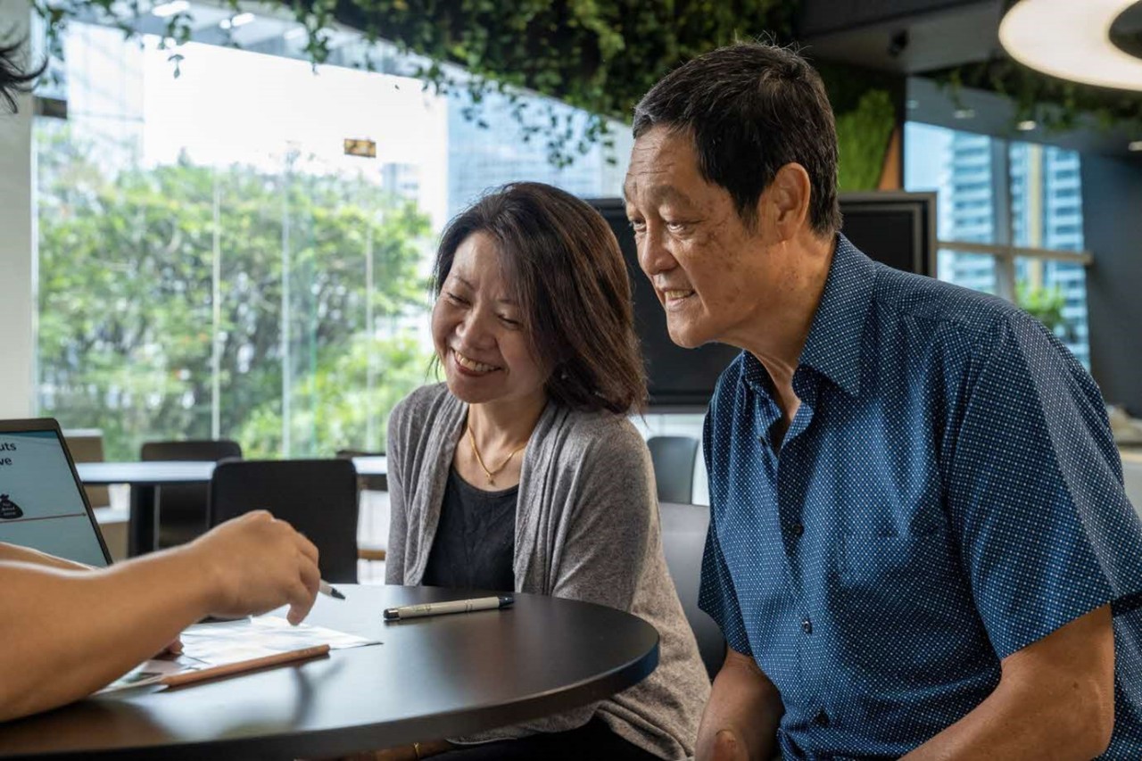 Elderly couple looking at documents