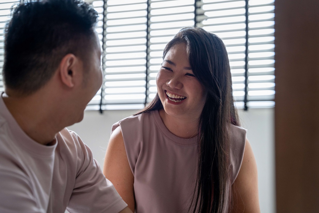 Lady smiling at home with her husband