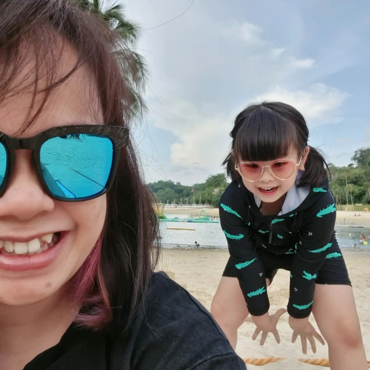 Yee Ting with her daughter at the beach.