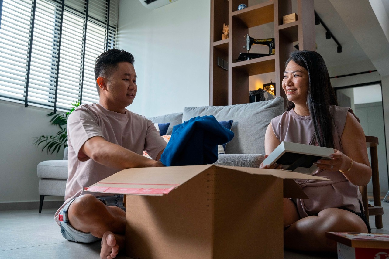 Young couple unpacking in their new home