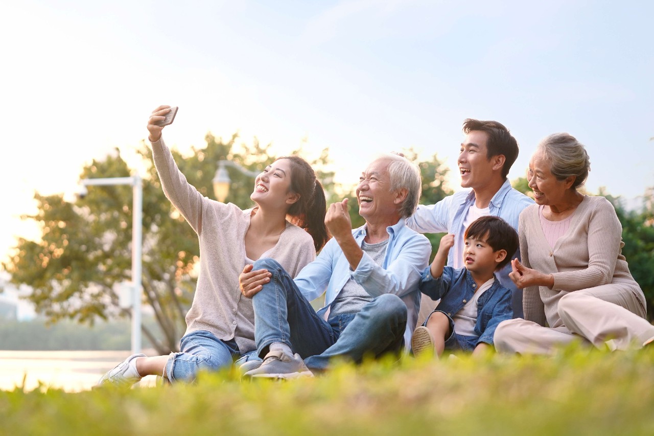 3 generation asian family taking a selfie