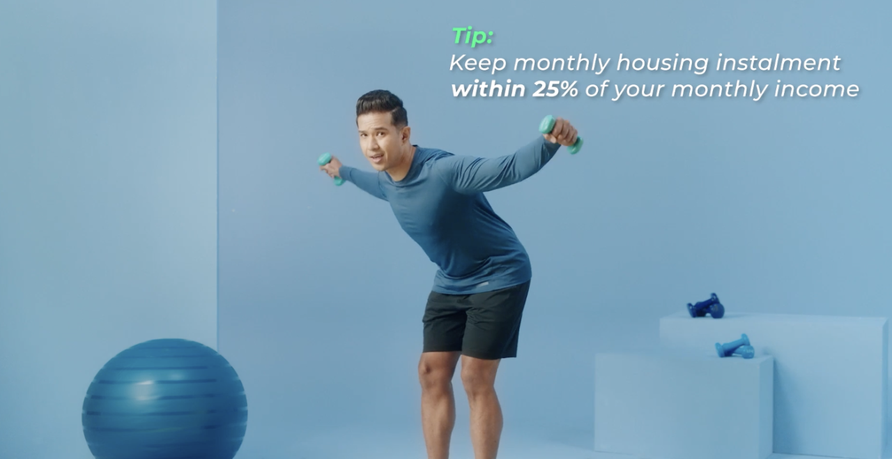 Radio personality Shaun Tupaz doing reverse dumbbell fly while giving the tip to keep monthly housing instalment within 25% of your monthly income.  