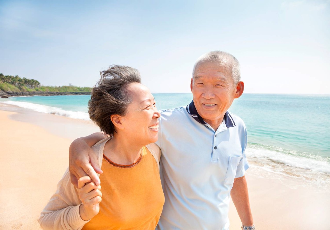 Elderly couple on the beach 