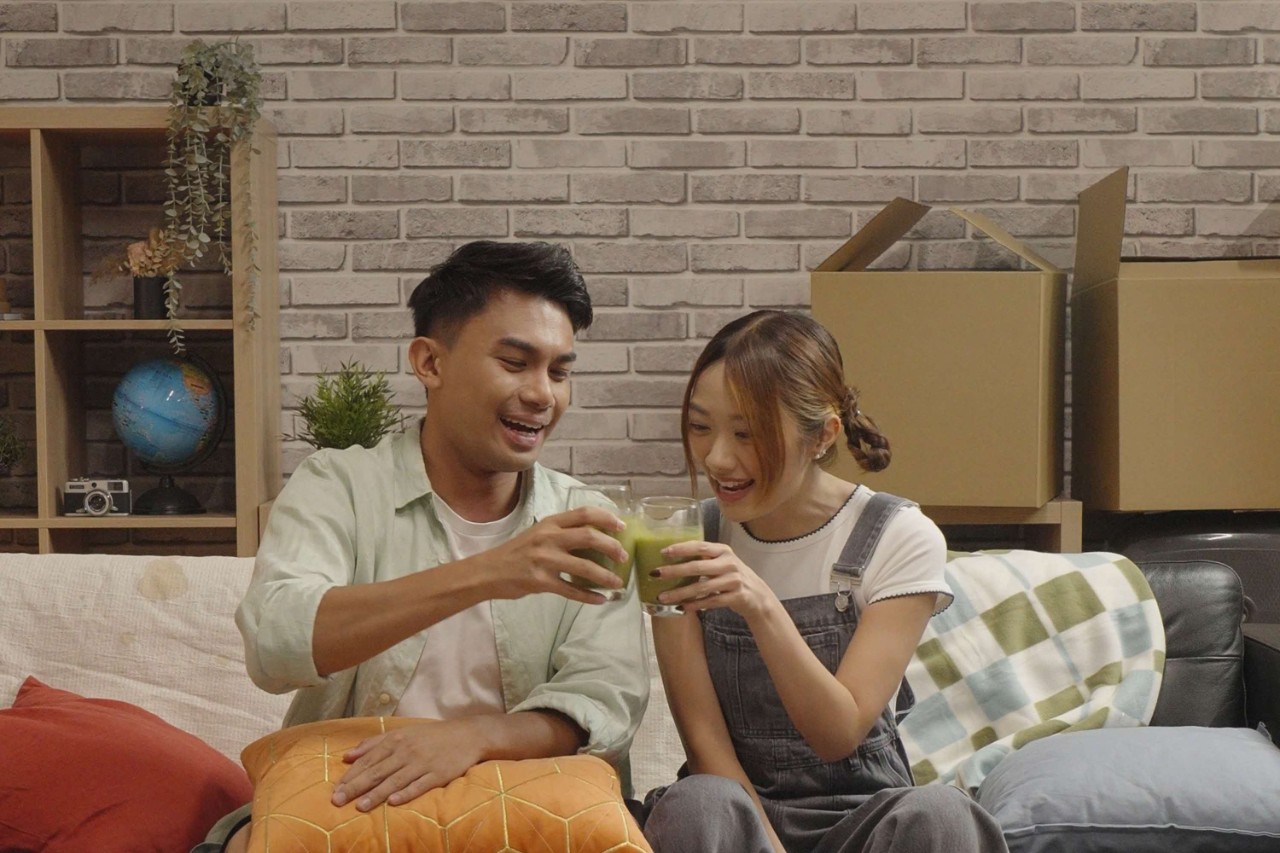 Young couple happily celebrating
