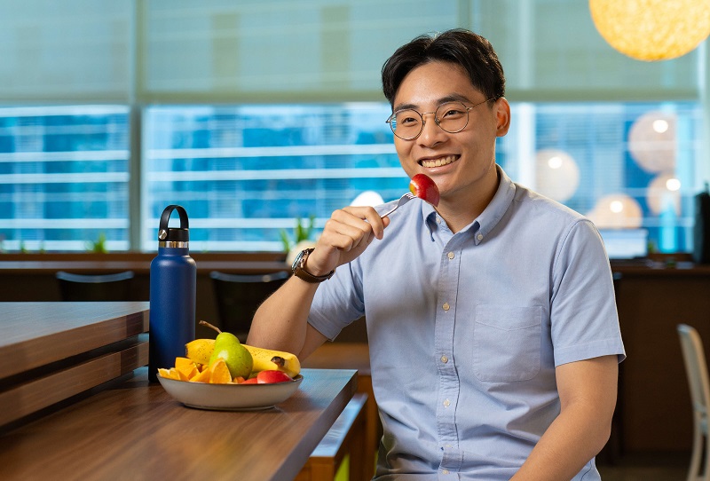 young man eating fruits