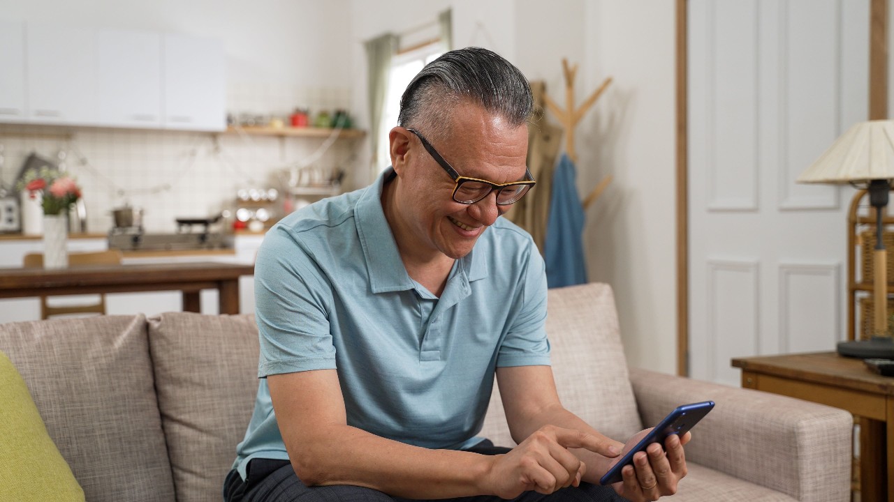 Senior man smiling in his home