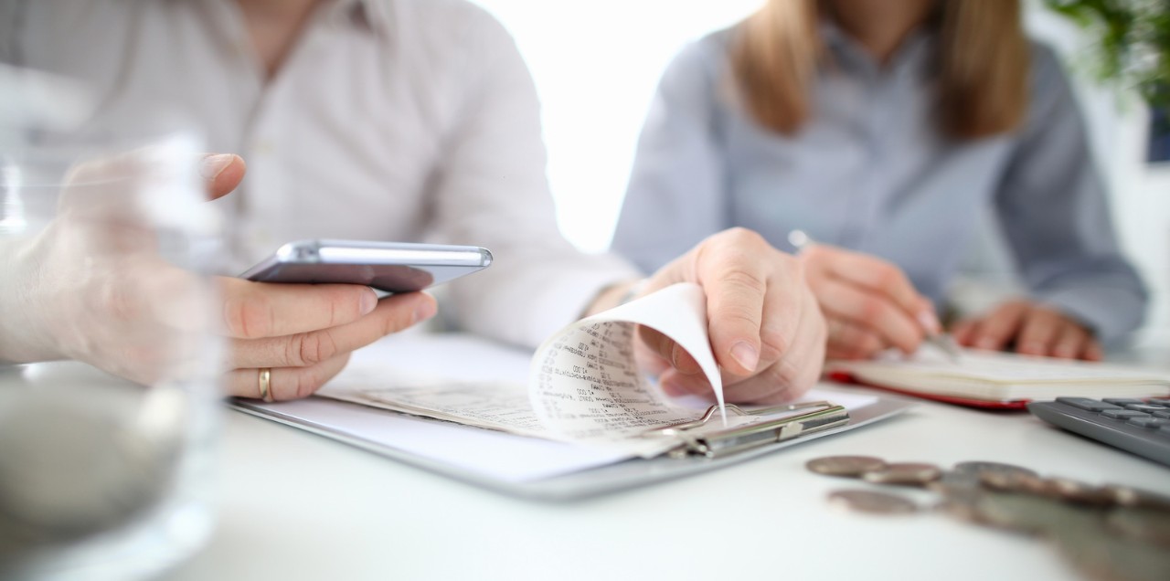 Image of a person calculating bills