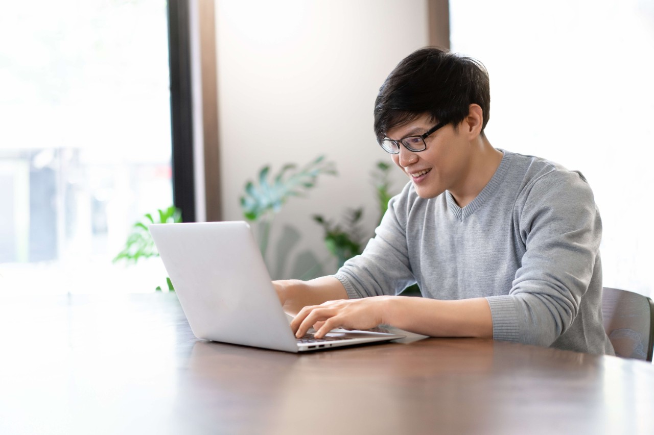 Adult man using laptop