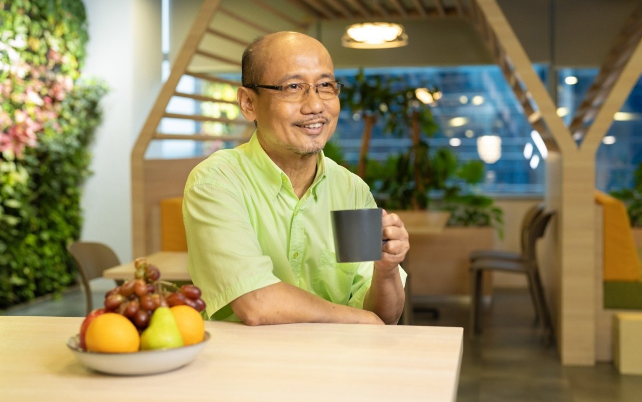 senior man enjoying his cup of hot beverage
