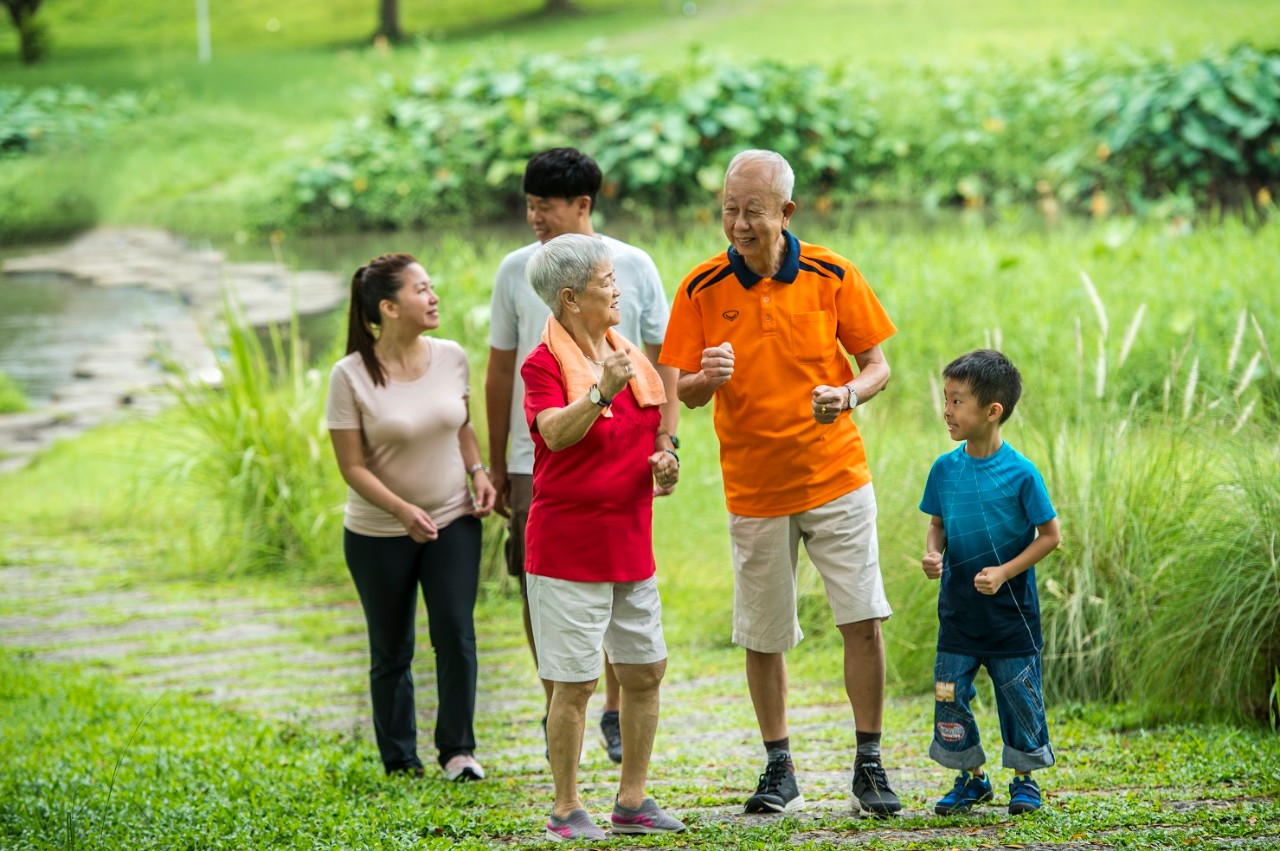 Asian Chinese family of three generations taking a walk in the park together