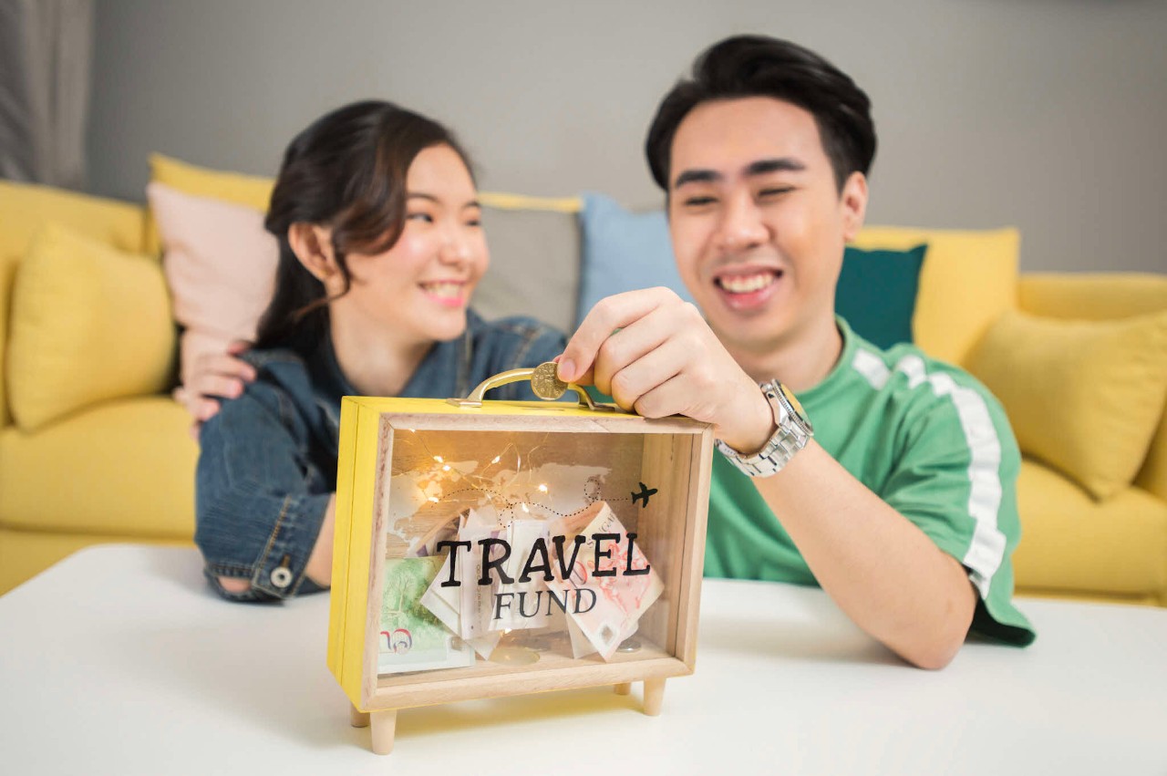 Young Chinese couple with travel fund 
