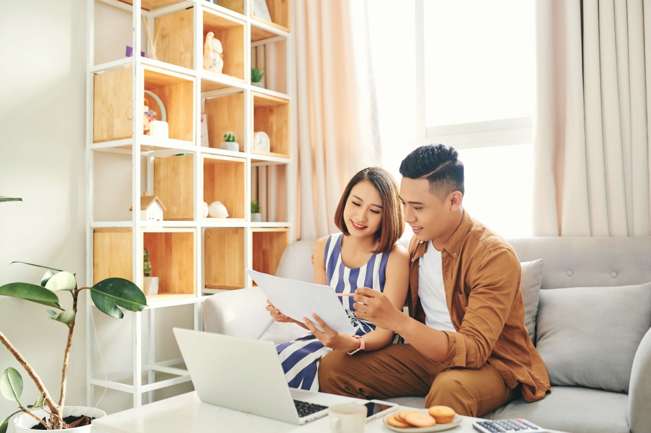 Young couple planning finances together