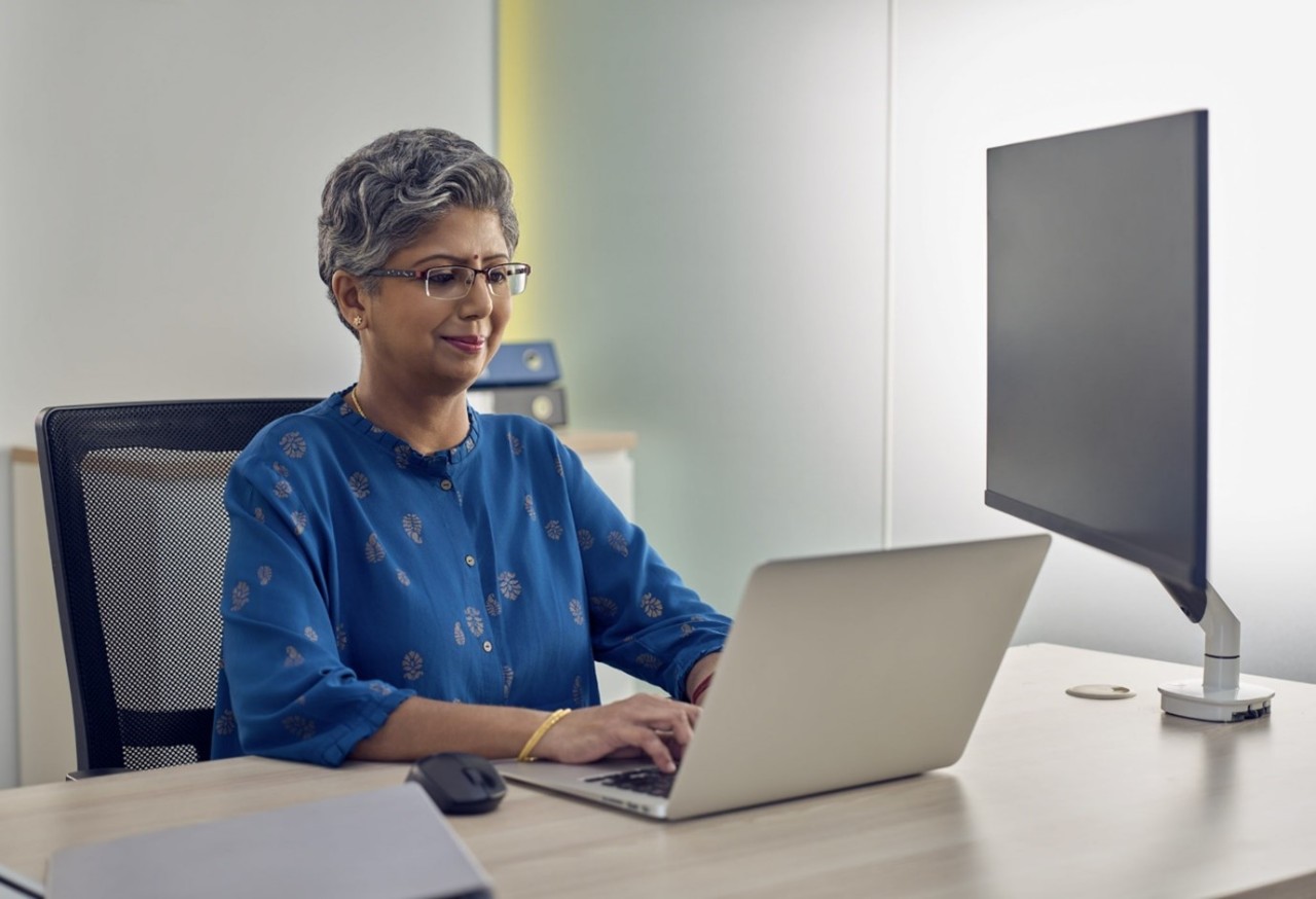 Lady looking at her laptop