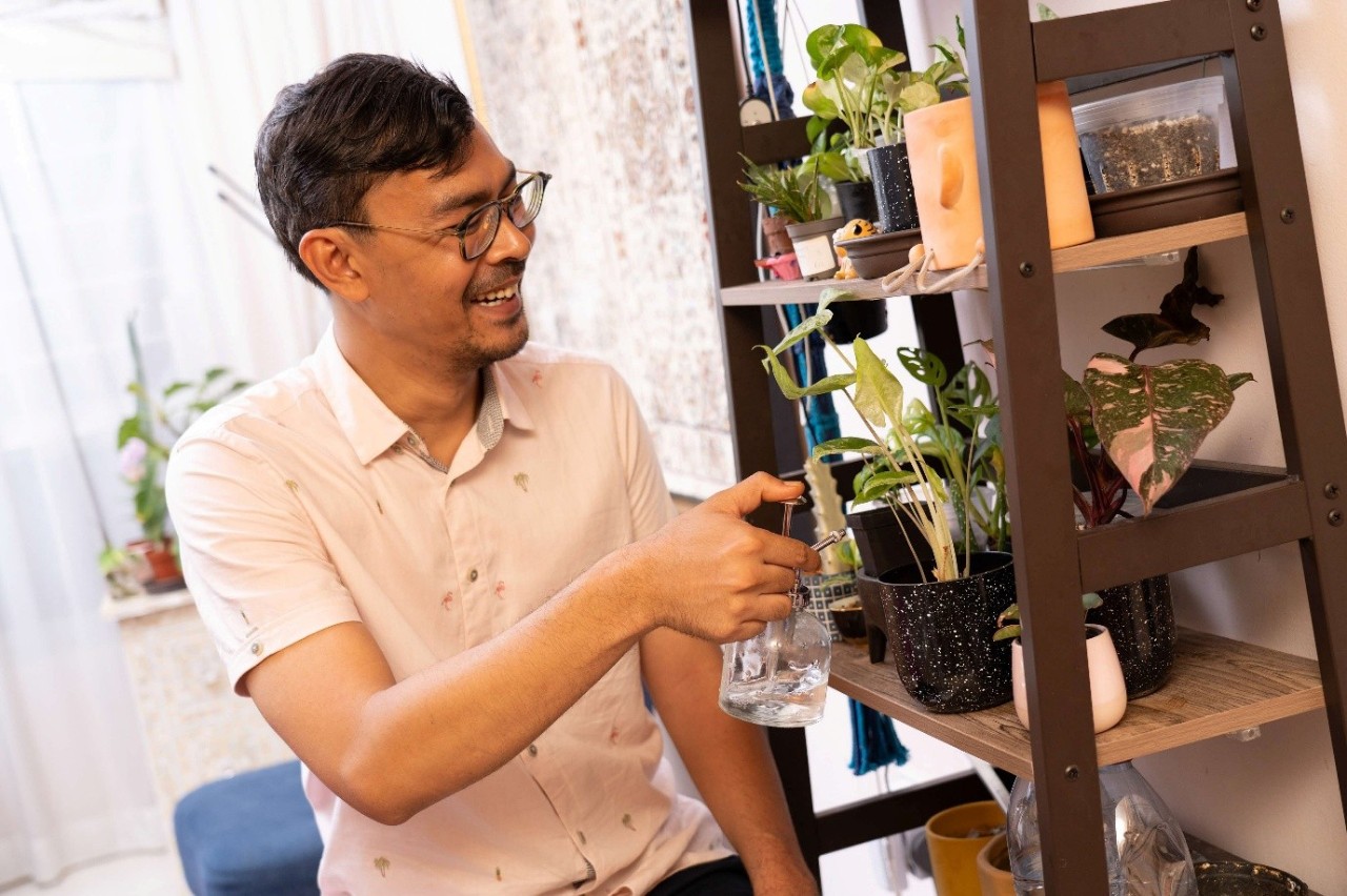 Man watering his plants