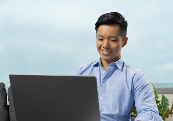 Male adult looking at his laptop