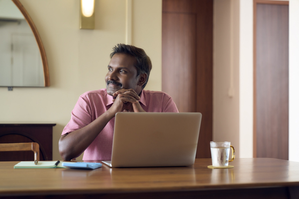 Man looking at his laptop