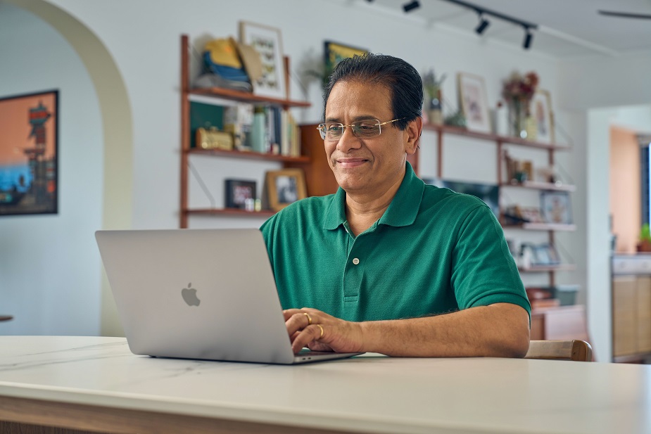 Elderly man using laptop