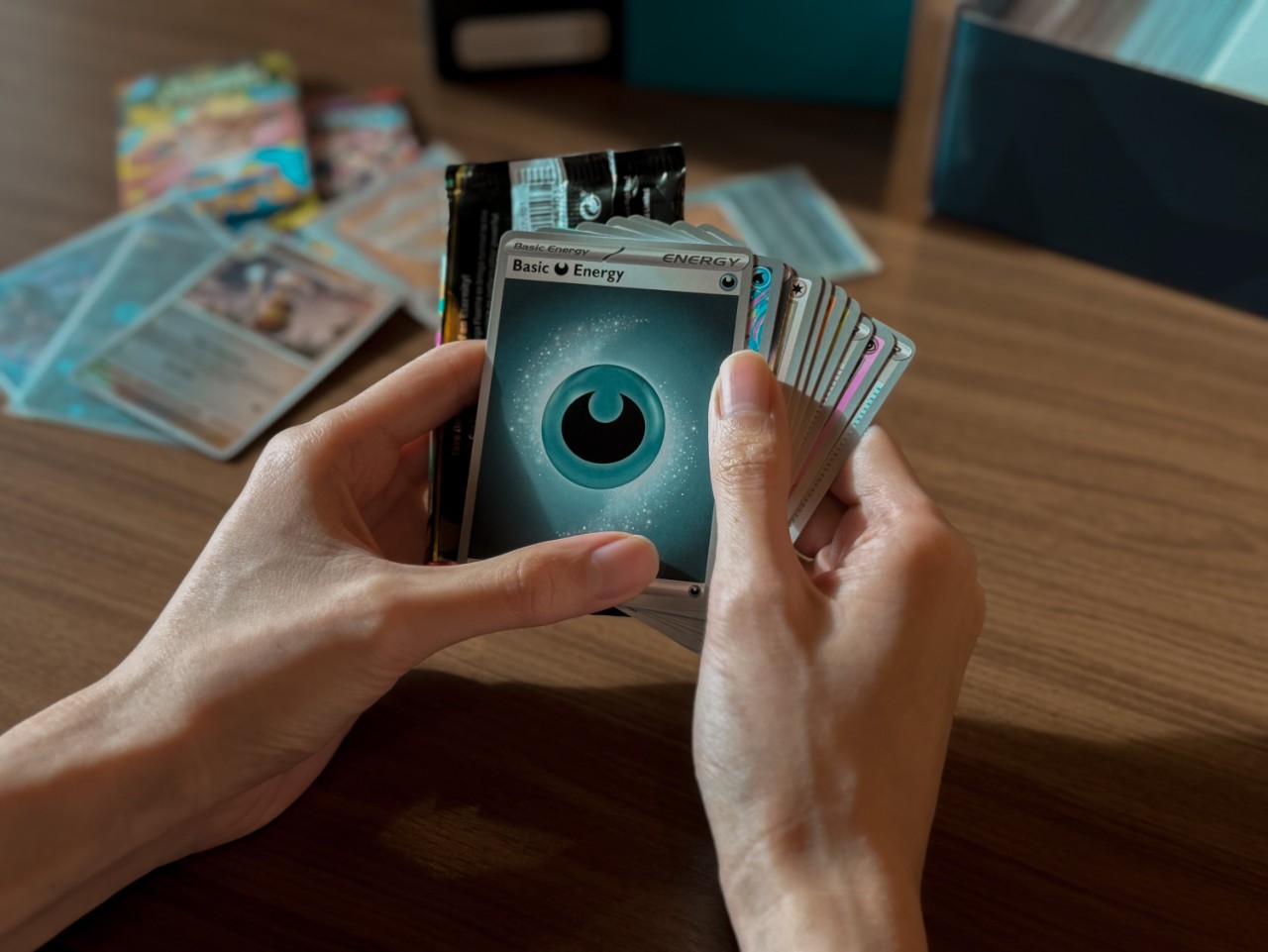 Person holding pokemon cards