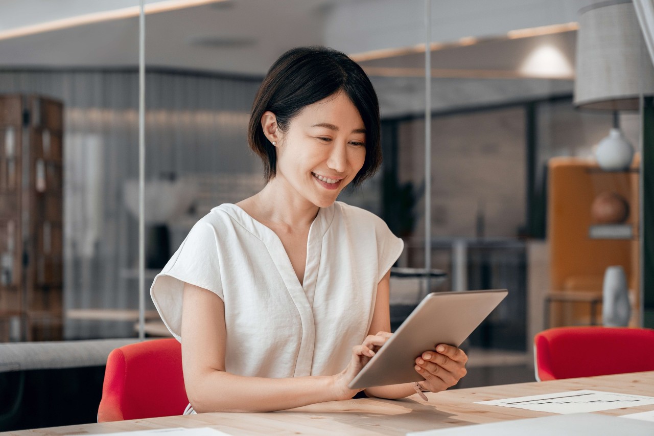 lady looking at her tablet