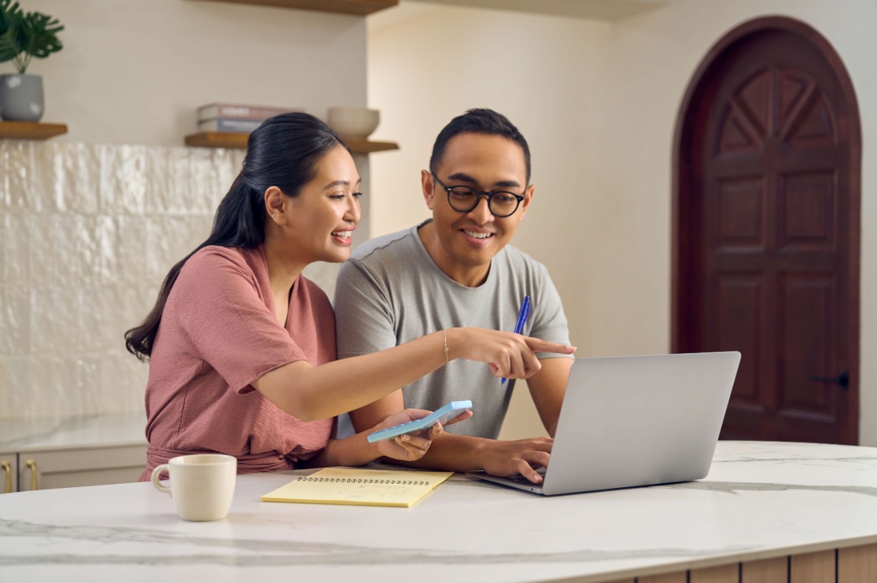 Young couple planning for their first home