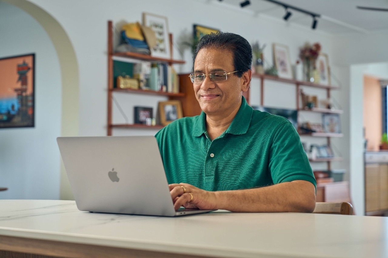 Senior male looking at his laptop