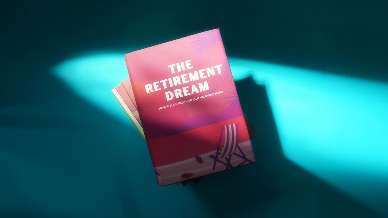 A red book tilted "The Retirement Dream"